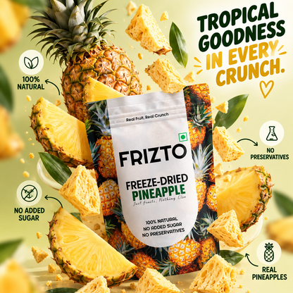 A bag of Frizto Freeze-Dried Pineapple snack is centered in a promotional composition with whole pineapples, sliced pineapple, and crunchy pineapple pieces around it. The package is white with green and orange tropical graphics, and the scene includes marketing text such as 'Tropical Goodness in Every Crunch' and callout icons for 100% natural, no preservatives, no added sugar, and real pineapple.